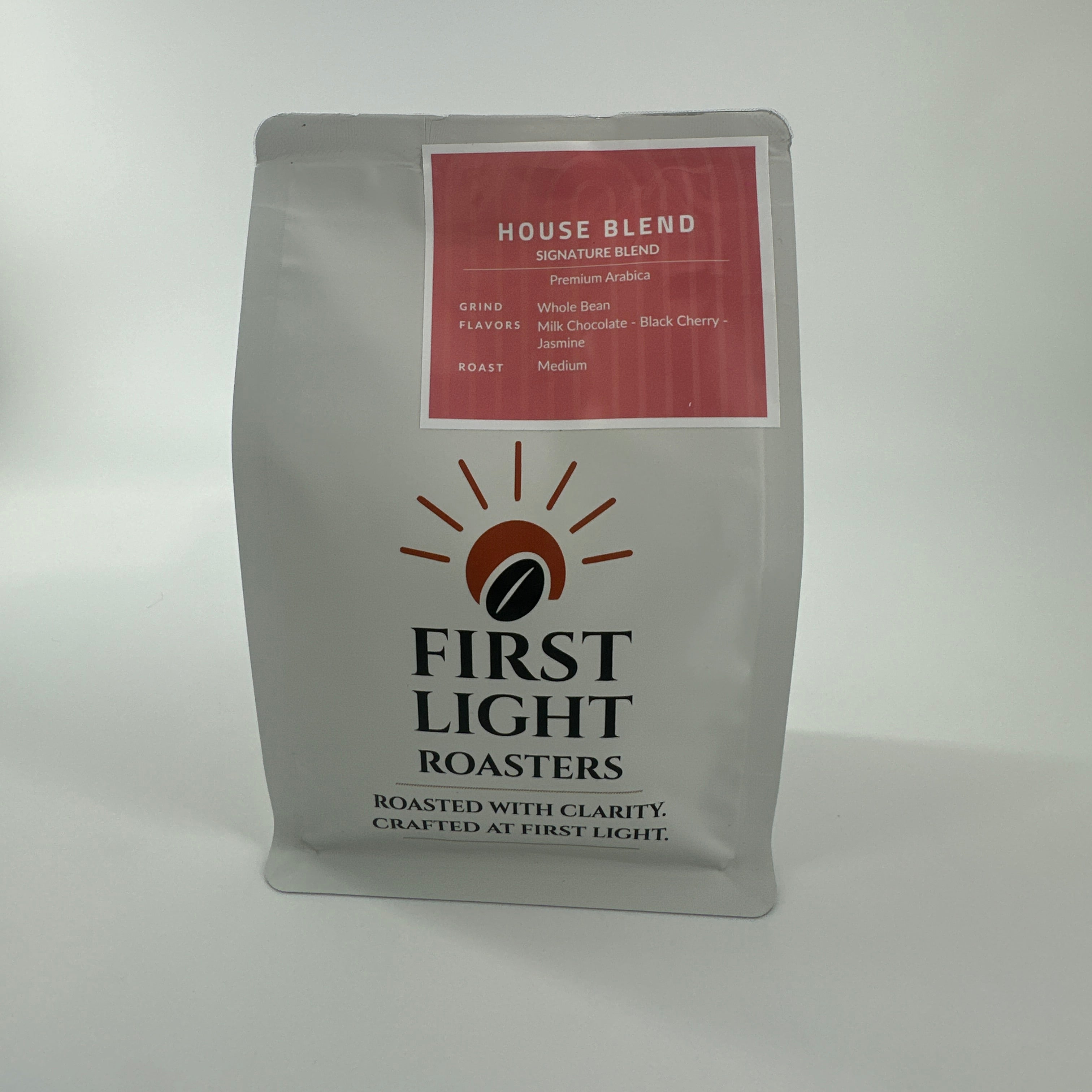 Coffee package with 'First Light Roasters' branding on a white background
