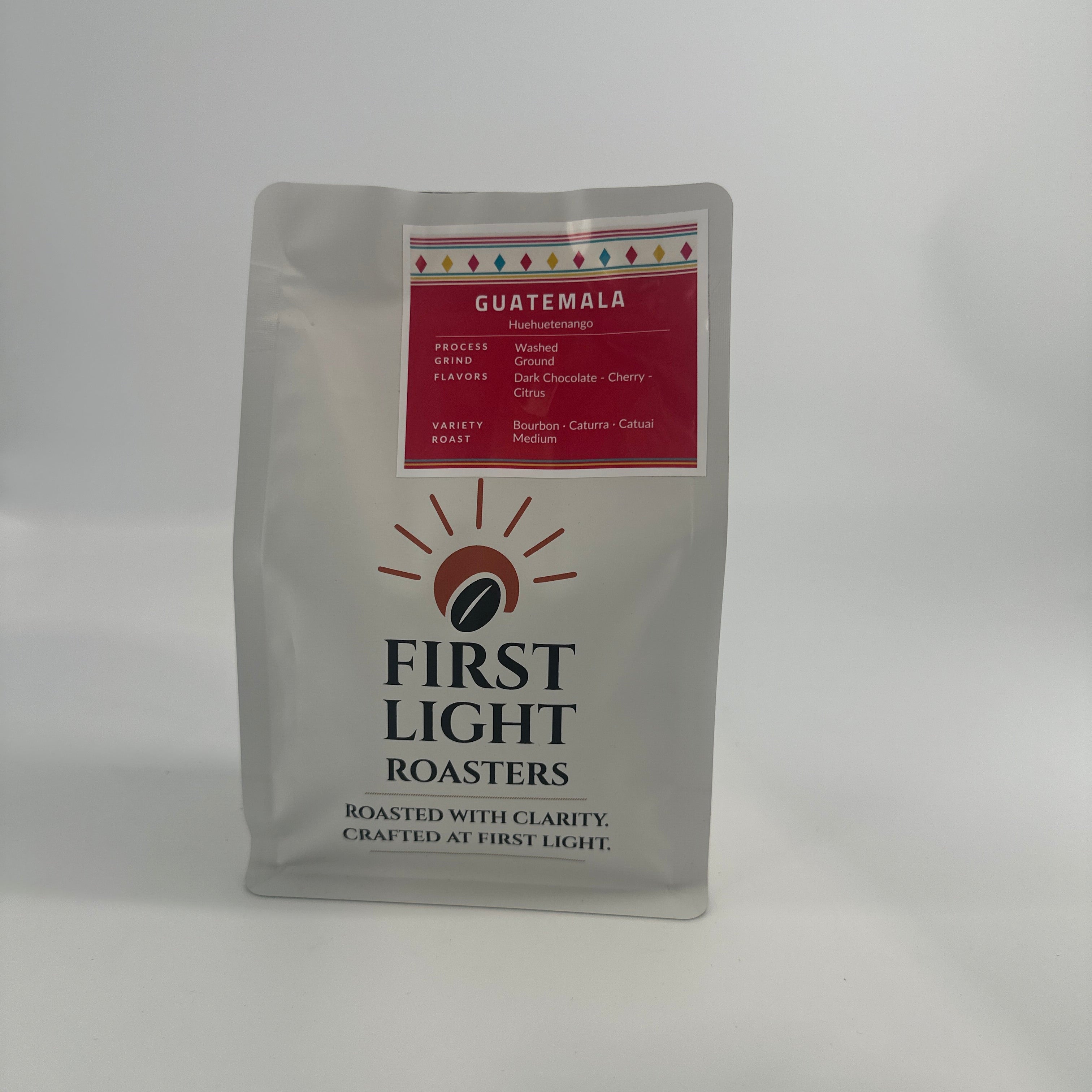 Coffee package from First Light Roasters on a white background